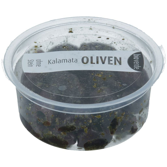 Kalamata-Oliven ohne Pesto und Kräuter, BIO, in einer 80 g Packung, von BIO VERDE, frische schwarze Oliven auf einem Teller