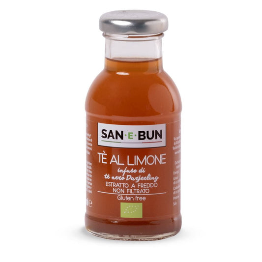 Glutenfreies Kräutergetränk mit Zitrone von SAN E BUN, 200 ml, in einer transparenten Flasche mit frischen Kräutern und Zitronenscheiben.