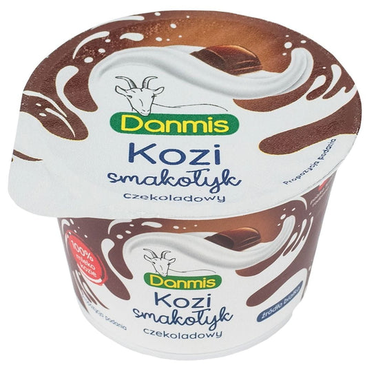 DANMIS Ziegenmilchschokolade, 100 g, cremale Schokolade mit Ziegenmilchgeschmack, zeigt die Verpackung und Schokoladestück.
