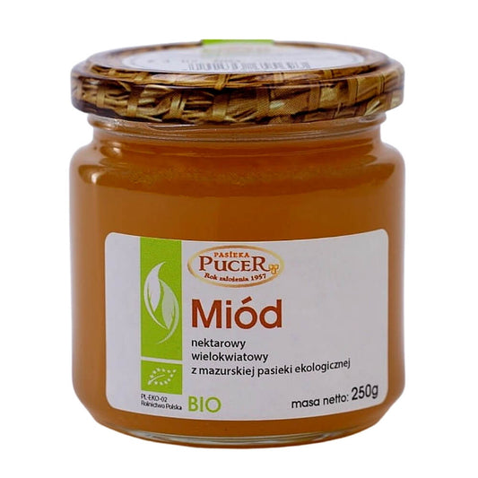 Bio Blütennektarhonig von PASIEKA PUCER in 250 g Glas, goldgelber Honig mit blumigem Duft und natürlicher Konsistenz.