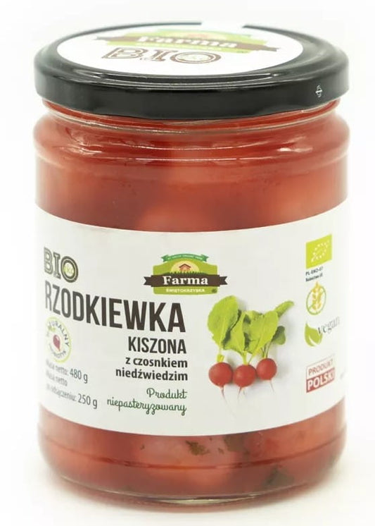 Eingelegter Rettich mit Bärlauch von biogo, glutenfrei und biologisch, in einer 480 g Verpackung auf einem Teller.