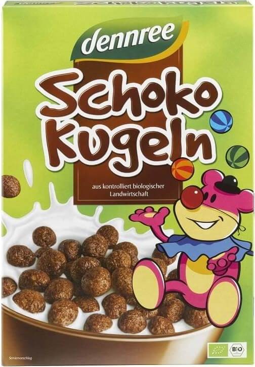 Schokoladen- und Frühstücksflocken mit Schokokugeln von DENNREE, Bio-Qualität, 250 g, in einer Schüssel mit Milch.
