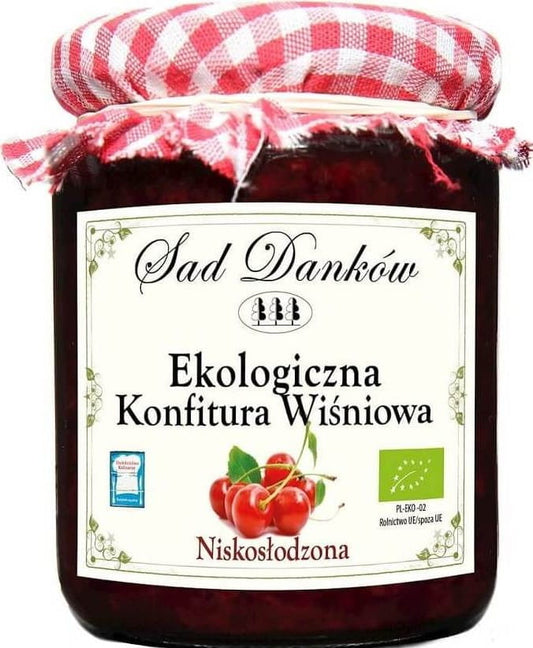 Bio Kirschmarmelade von SAD DANKÓW, zuckerarm, in 260 g Glas, zeigt frische Kirschen und die Marmeladenkonsistenz.