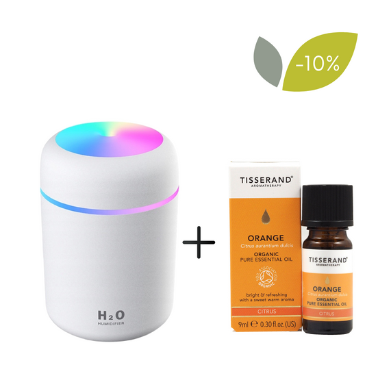 Diffusor-Set für ätherische Öle von TISSERAND, weiß mit orangefarbenem Bio-Öl 9 ml, zeigt den Diffusor und das Öl in der Flasche.