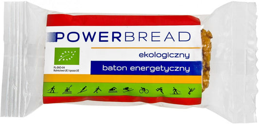BIO Powerbrot Energieriegel von EKOPRODUKT, 50 g, mit Vollkorn und Nüssen, liegt auf einem Holztisch, Nahaufnahme