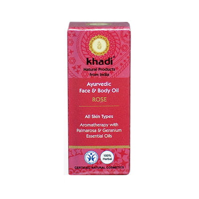 Ayurvedisches Gesichts- und Körperöl mit Rose, 10ml, von KHADI Naturprodukte, zeigt Flasche mit Rosenöl und Blüten.